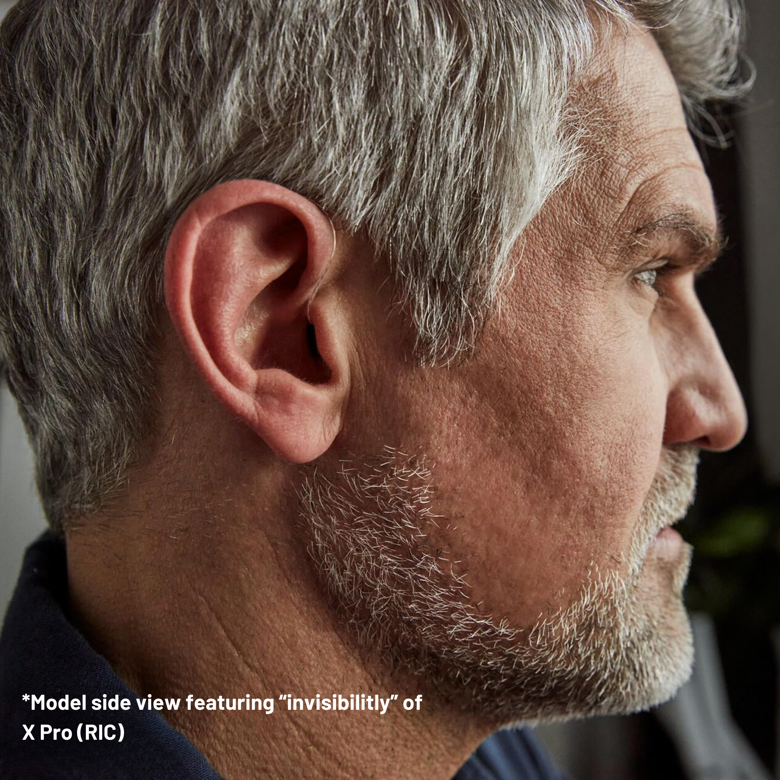 Side view of a man showcasing the discreet design of Hearmonic X Pro (RIC) hearing aid.